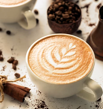 latte with foam in design served in a cup