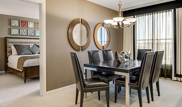 a dining table with chairs in a room