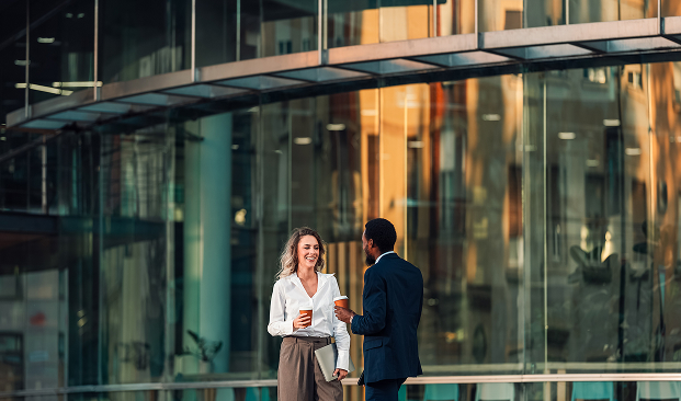 a man and woman talking outside