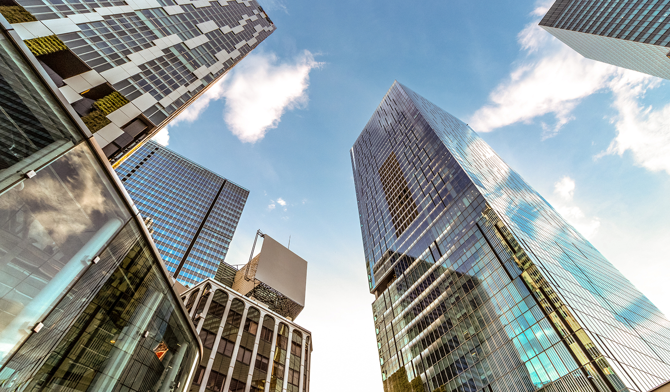 looking up view of tall buildings