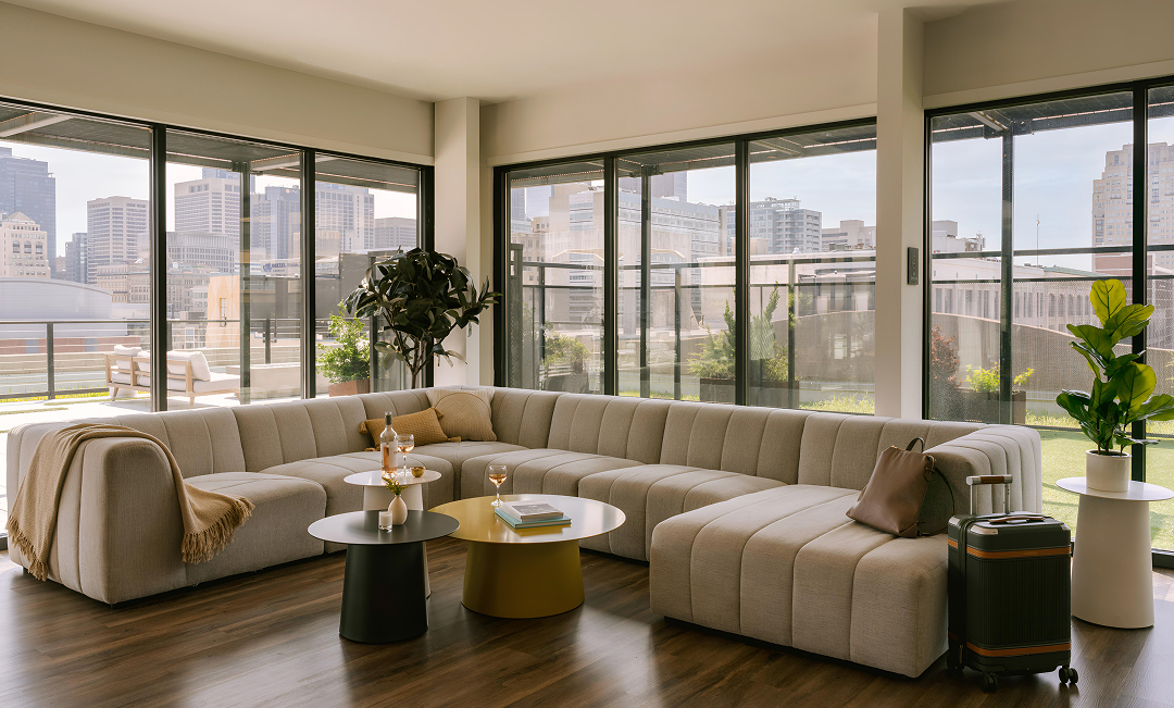 a living room with a large couch and a coffee table