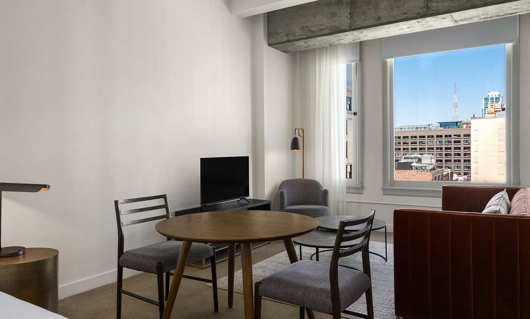 a room with a table and chairs