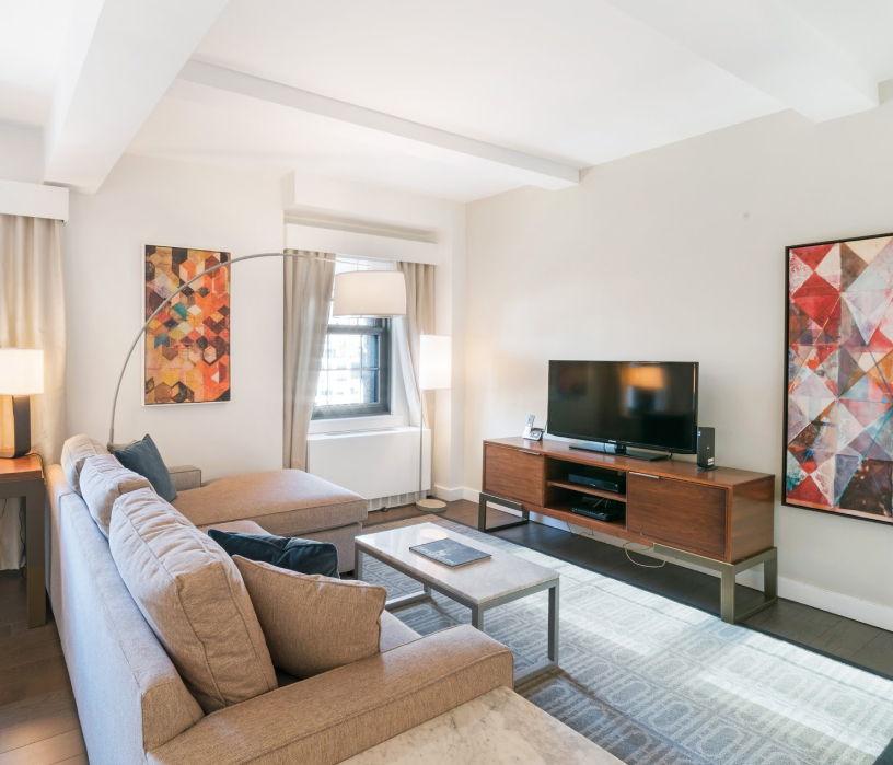 a living room with a couch and a tv