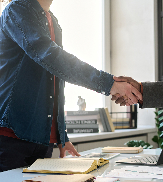 a man shaking hands with another man