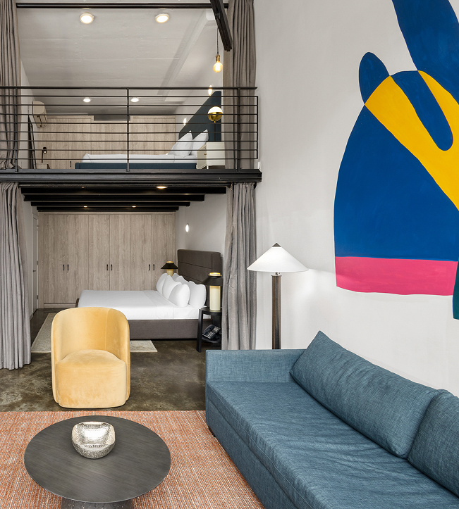 a room with a sofa and a bed
