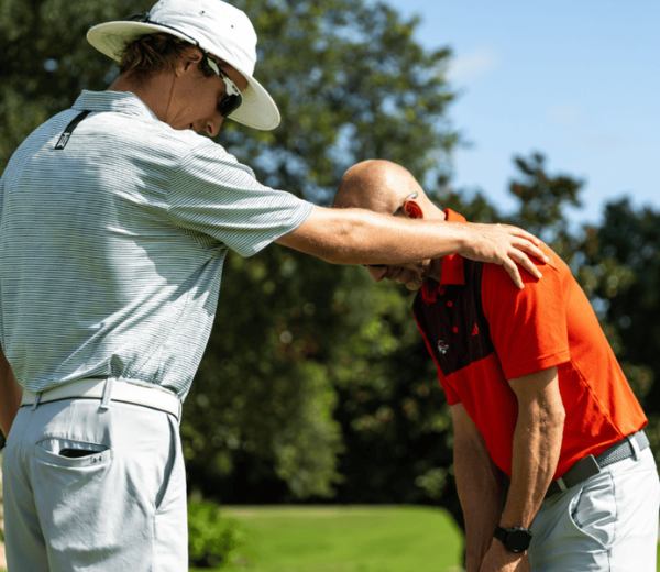a man holding another man's head