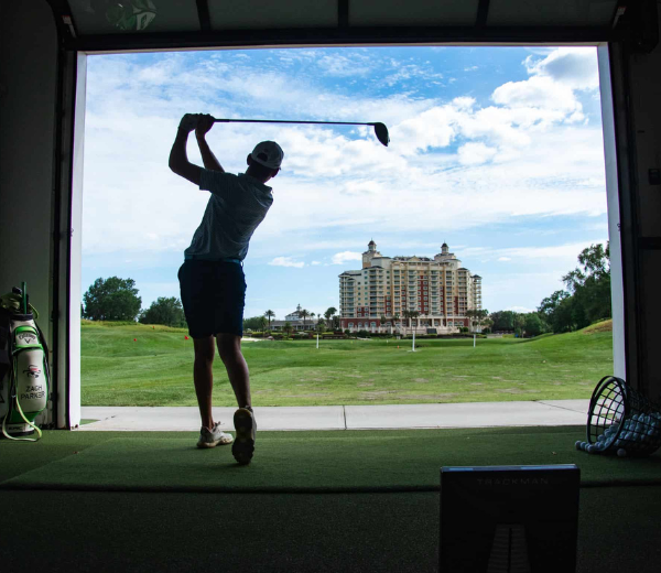 a man swinging a golf club