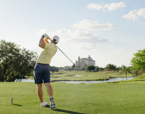 a man swinging a golf club