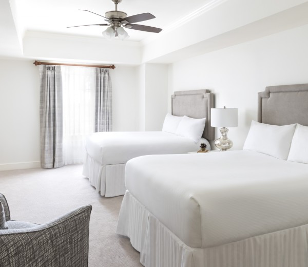 a bedroom with a bed and a chair