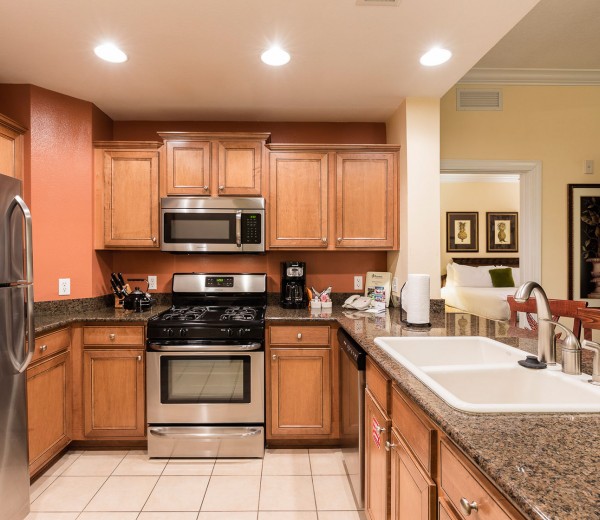 villa kitchen with wooden cabinets