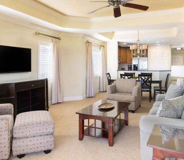 a living room with a tv and couches