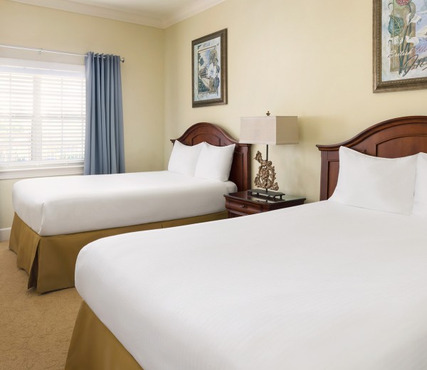 a hotel room with two beds