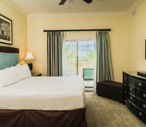 a bedroom with a large window