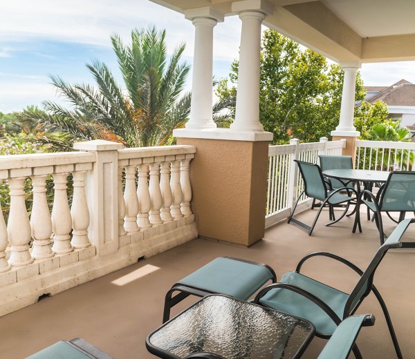 a patio with chairs and tables