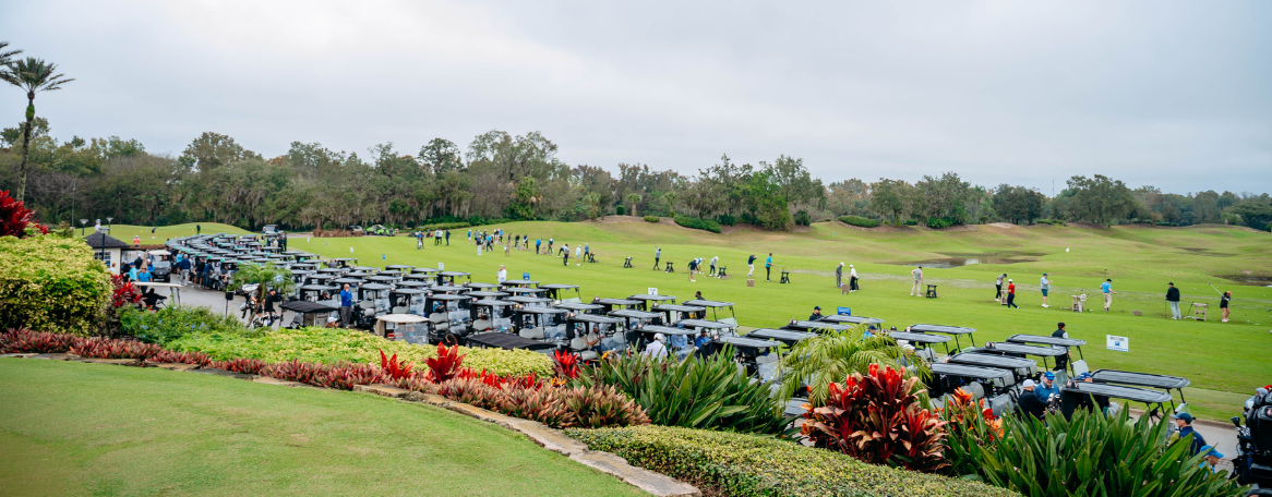 a group of people on a golf course