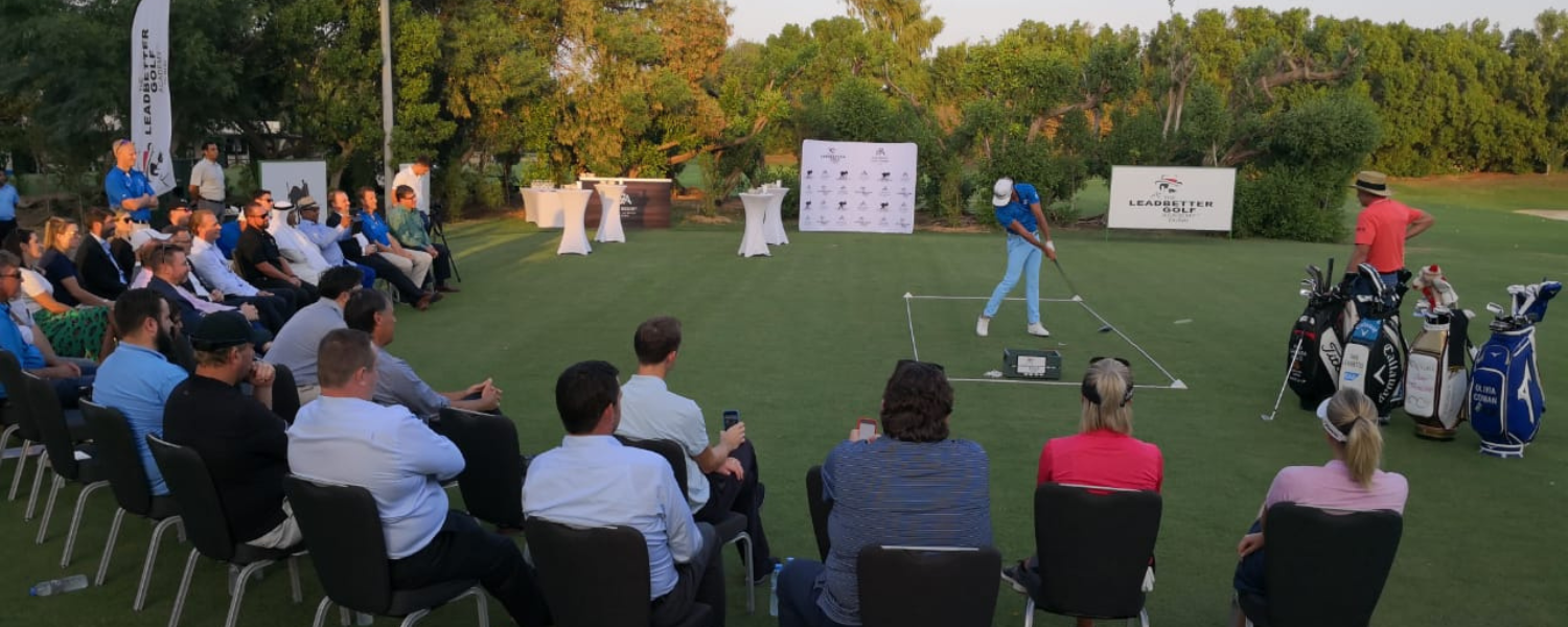 a man playing golf on a golf course
