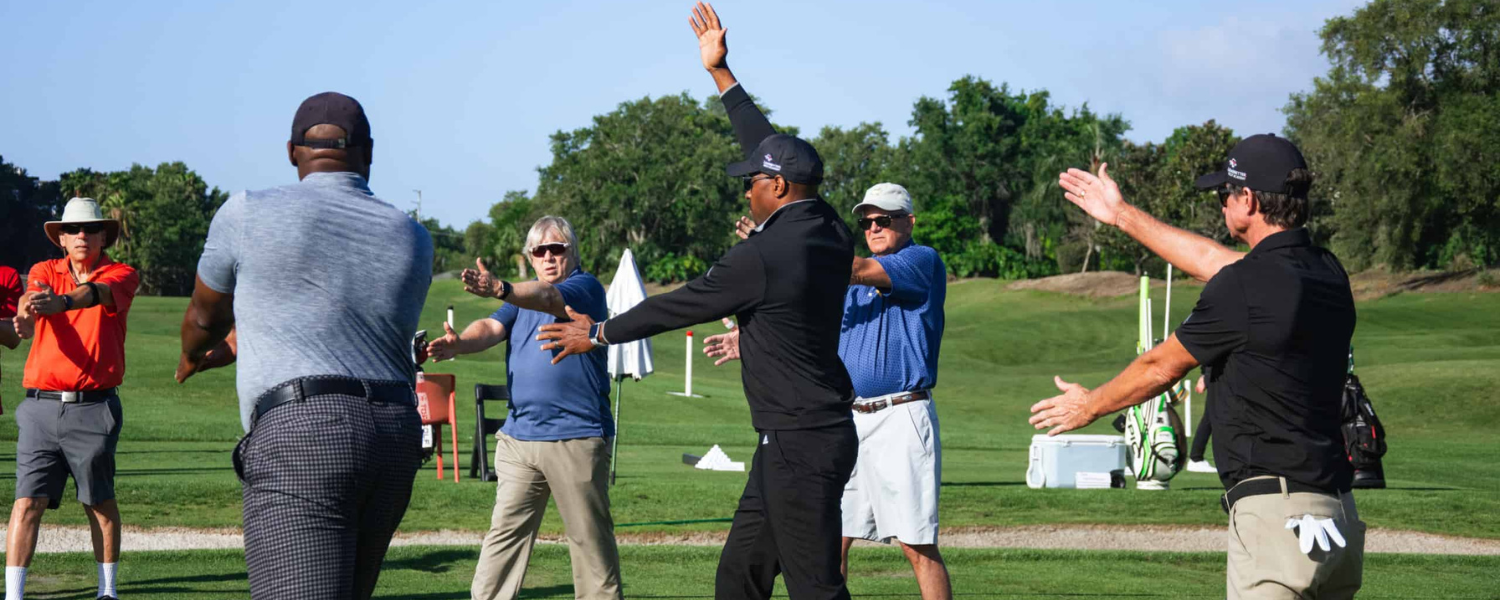 a group of people on a golf course
