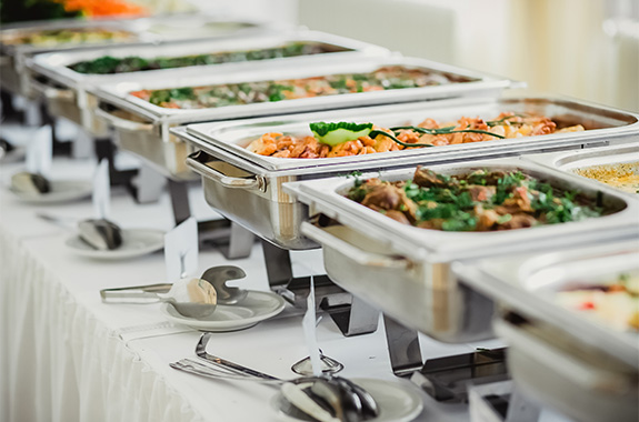 a row of food containers on a table