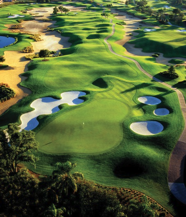 a golf course with sand bunkers