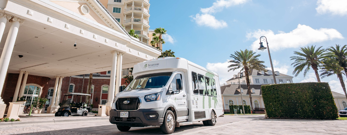 a white van parked in front of a building