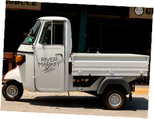 a small white truck with black text