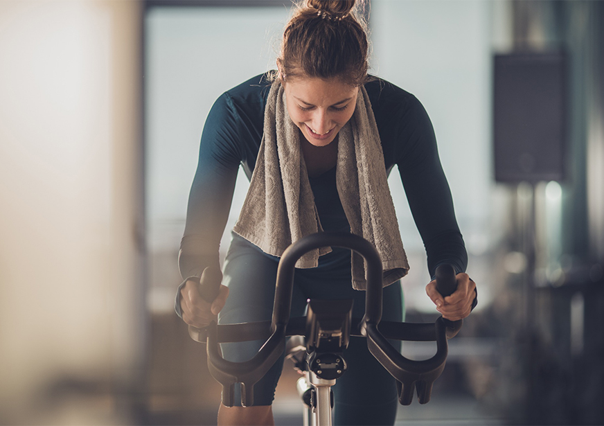 a woman on a stationary bike