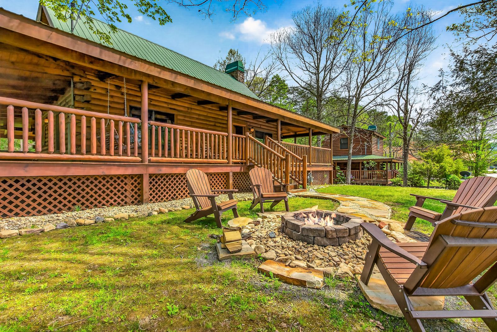 a log cabin with a fire pit