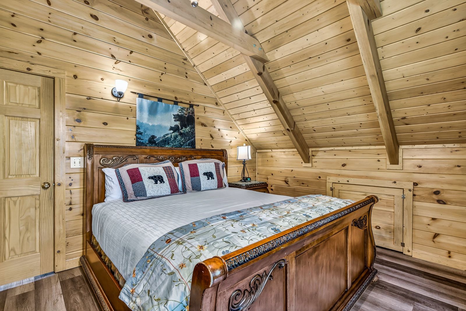 a bed in a wooden room