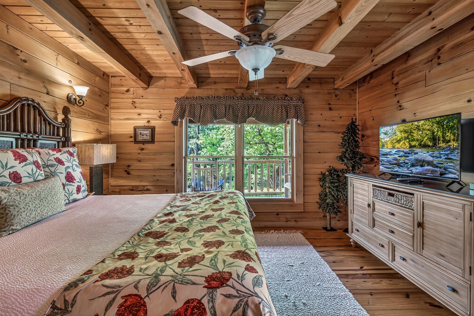 a bedroom with a television and a bed