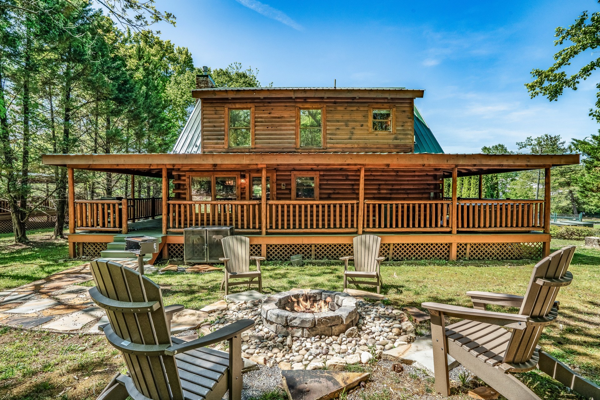 a log cabin with a fire pit