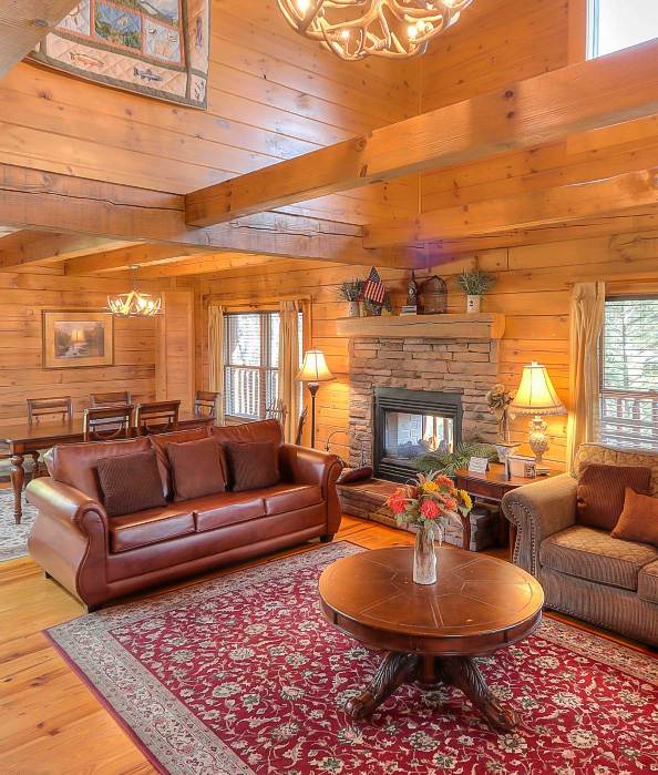 a living room with a fireplace and couches