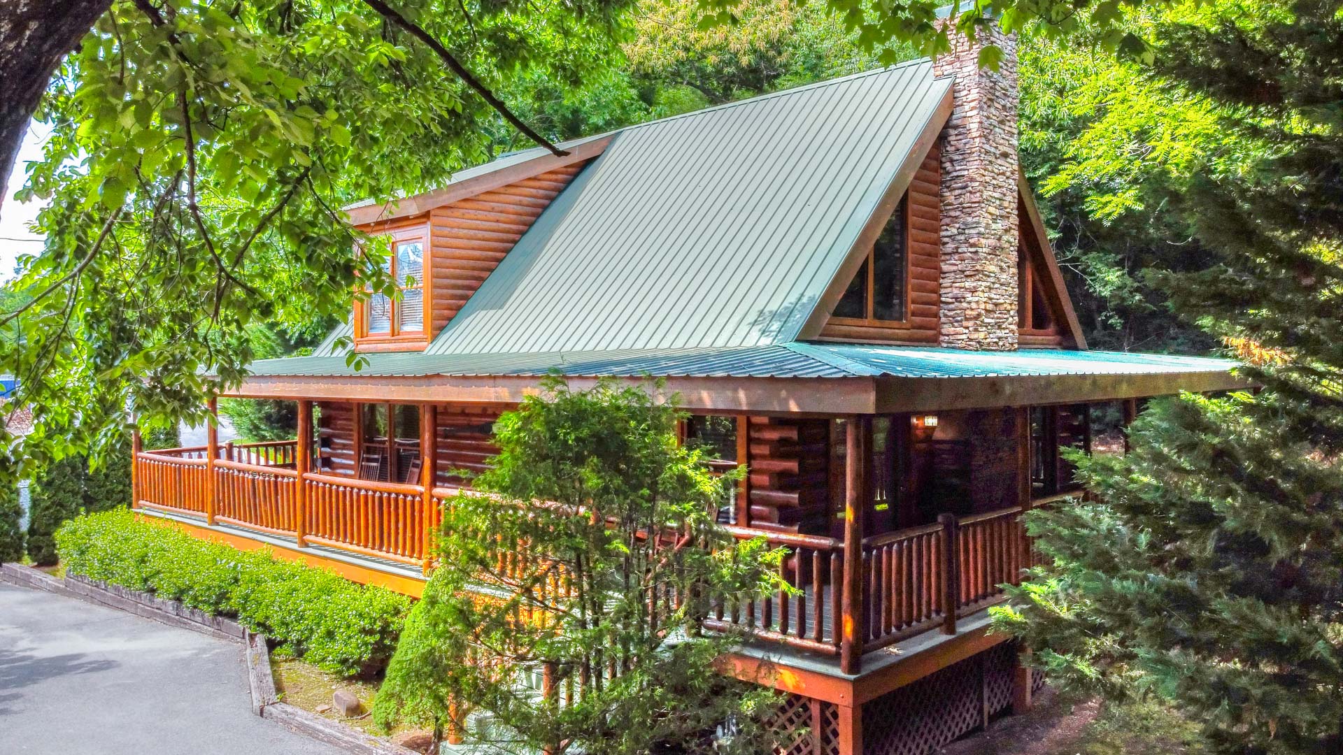 a log cabin with a porch and a chimney