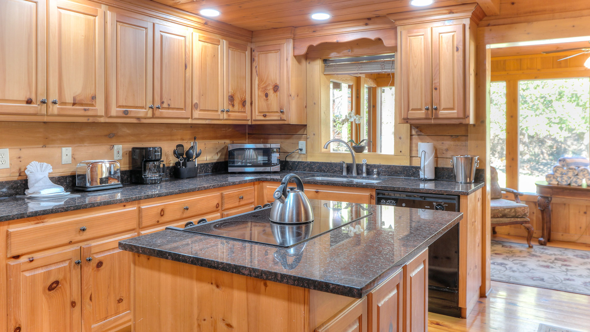 a kitchen with a stove and a kettle
