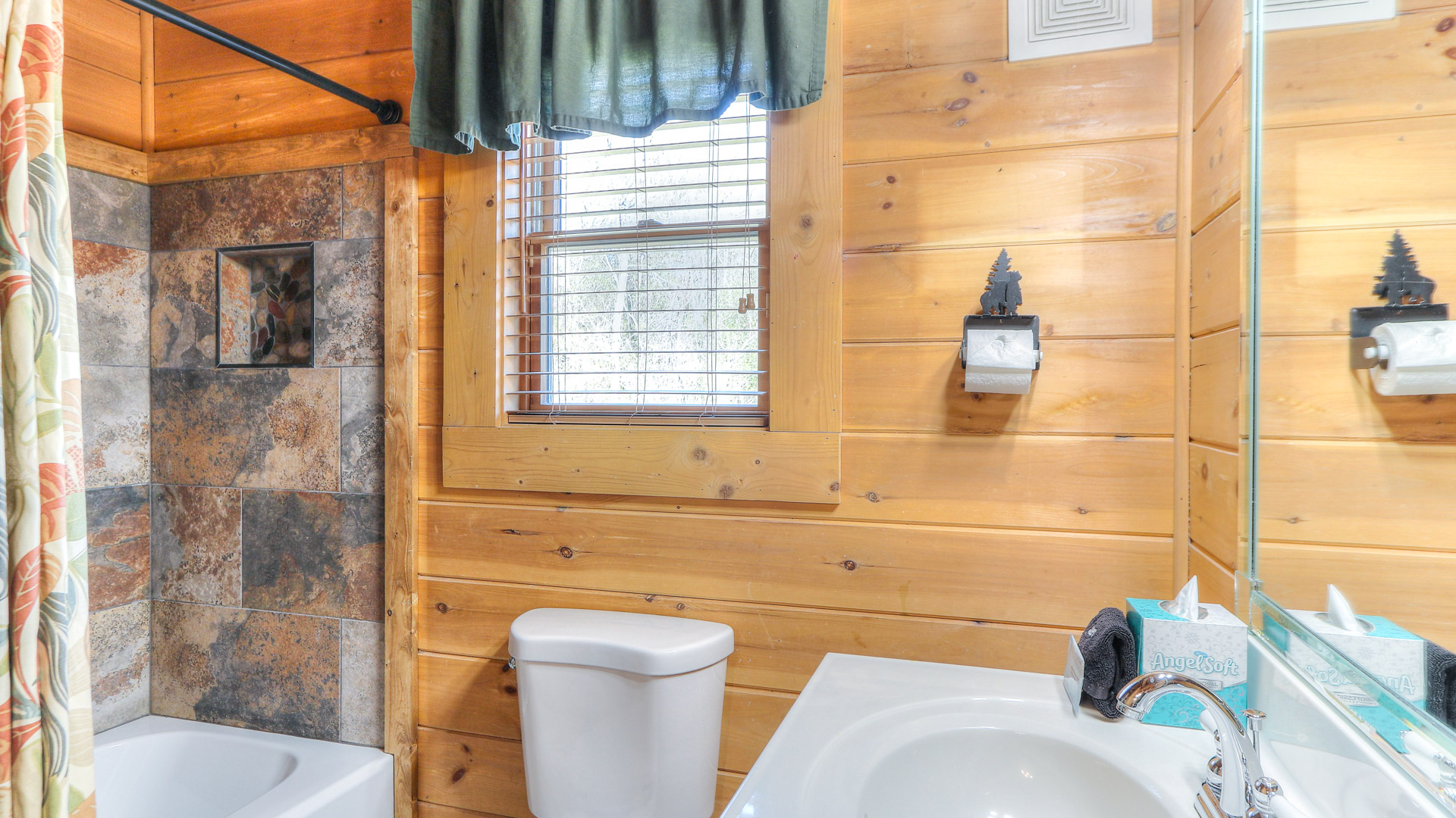 a bathroom with a toilet and sink