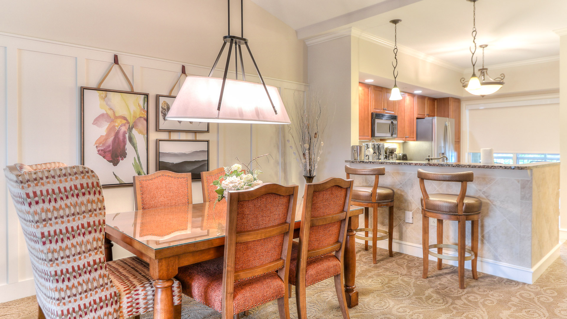 a dining room with a table and chairs