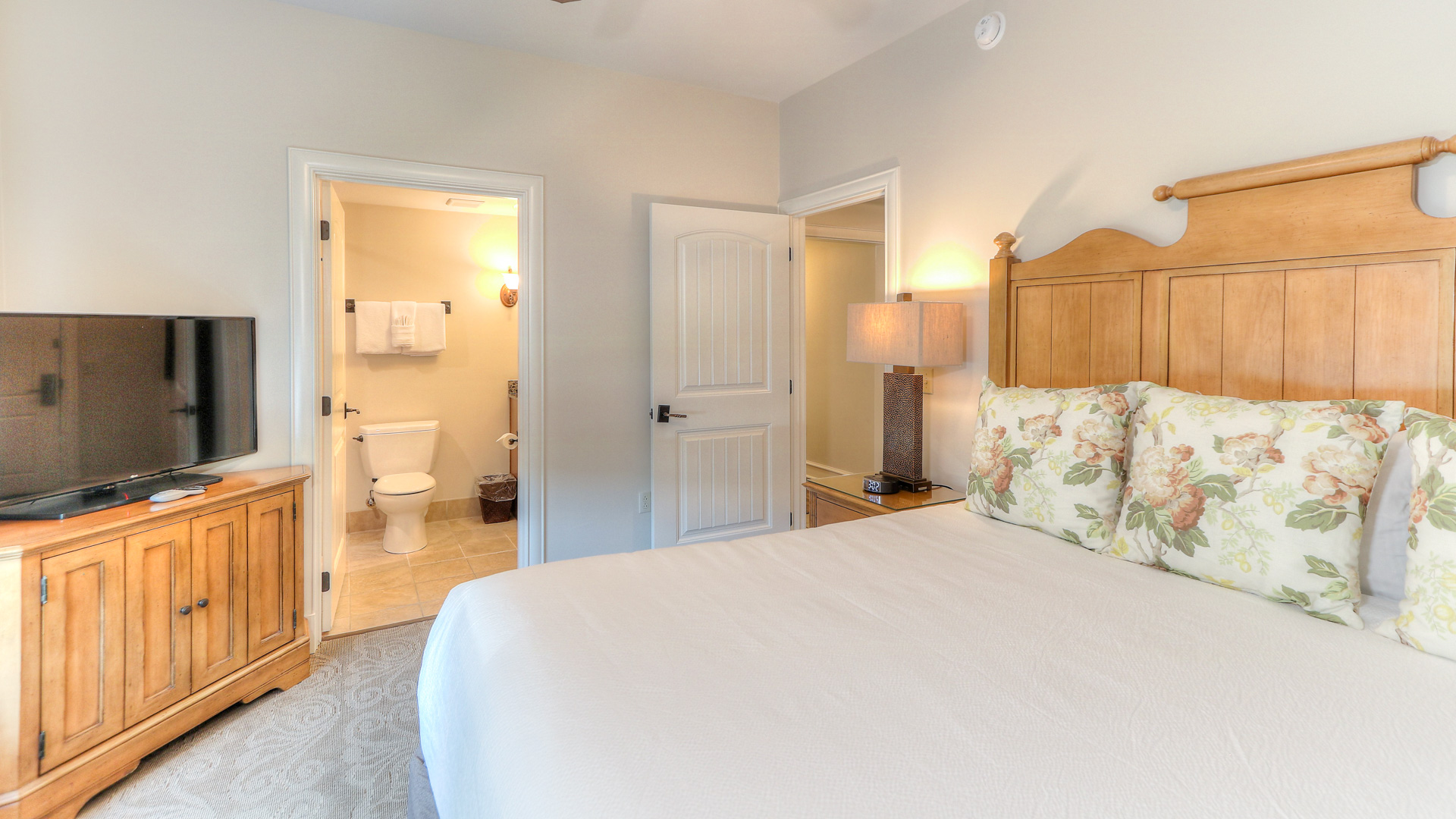 a bedroom with a bed and a toilet