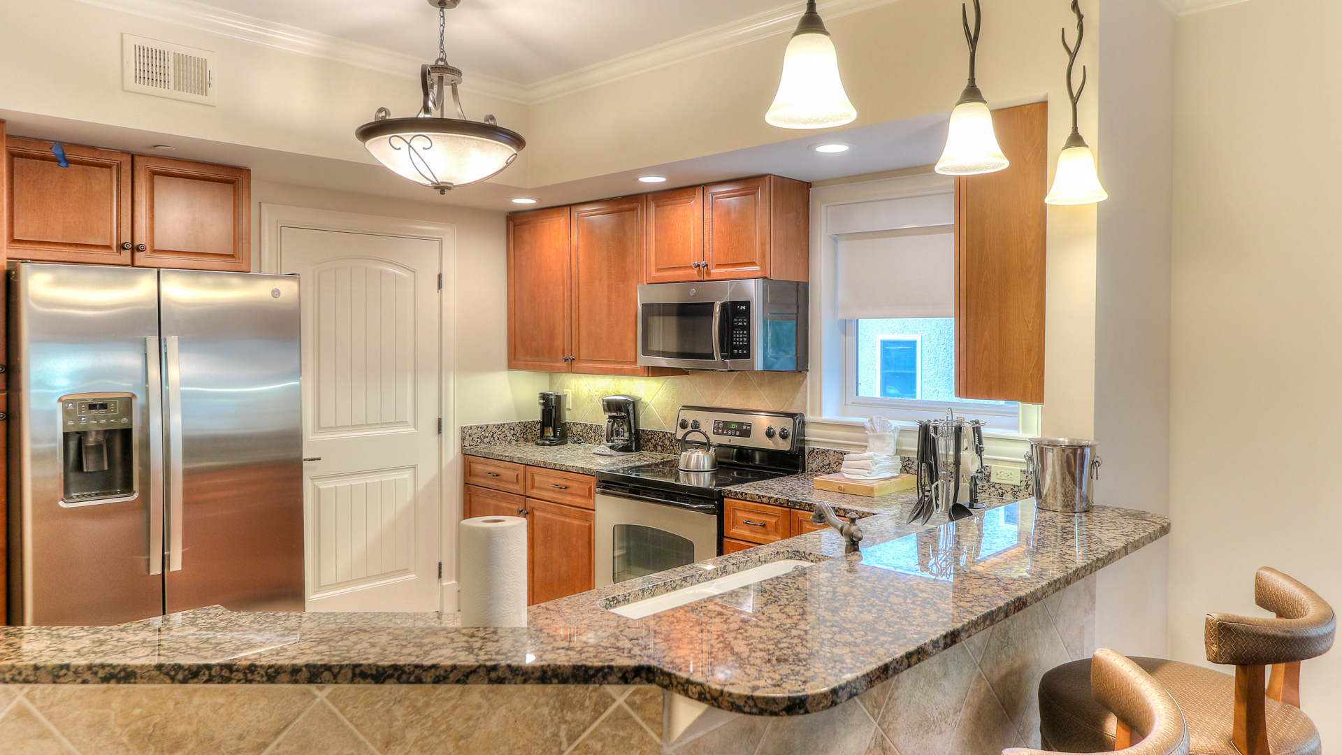 a kitchen with granite counter tops and a marble counter top