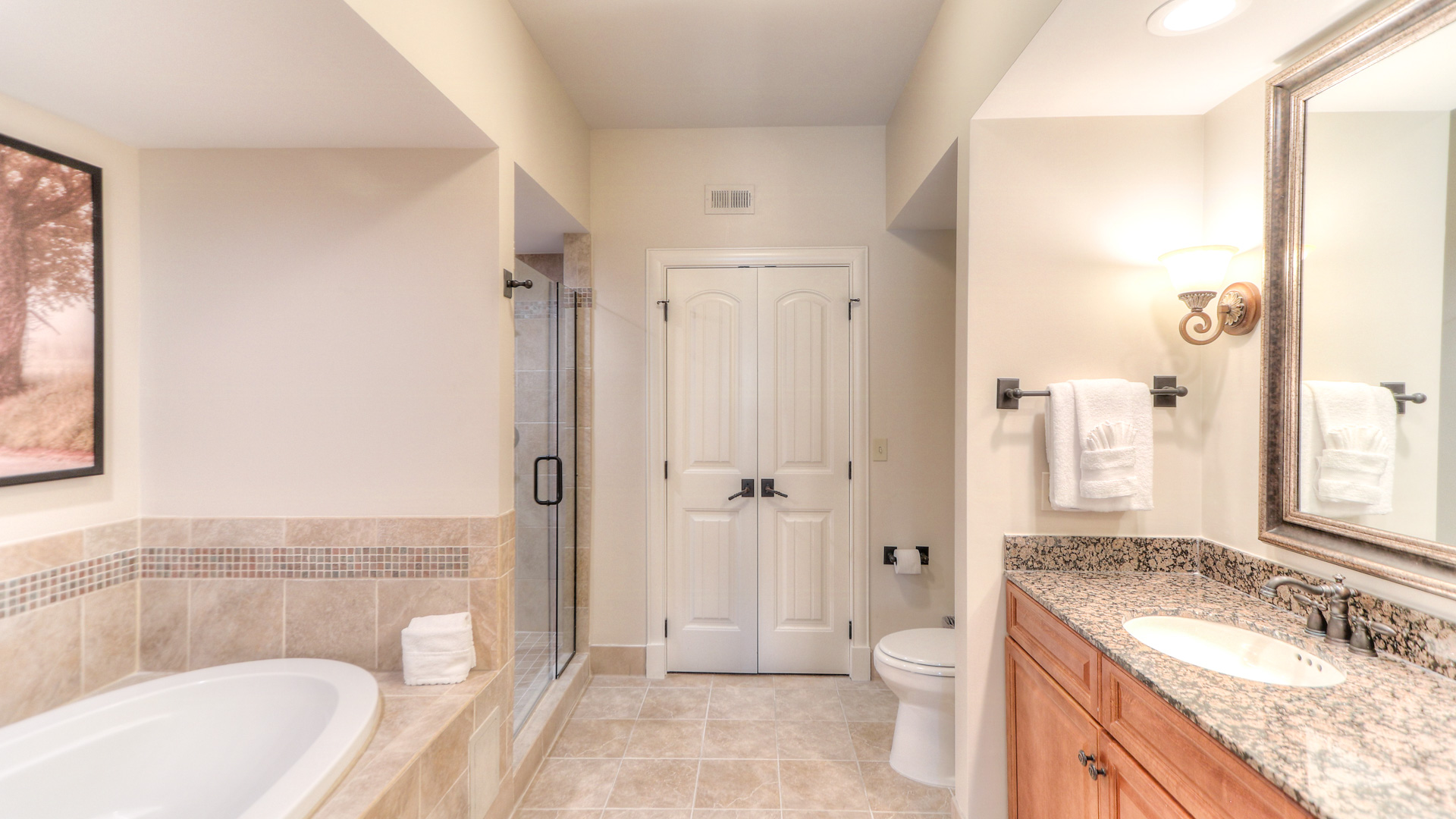 a bathroom with a sink toilet and shower