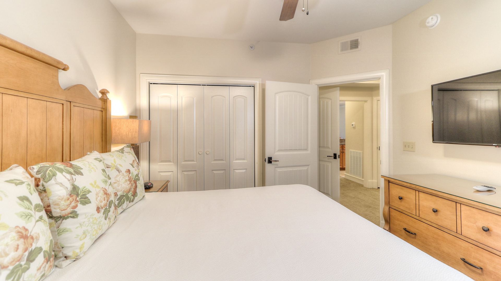 a bed in a room with white doors