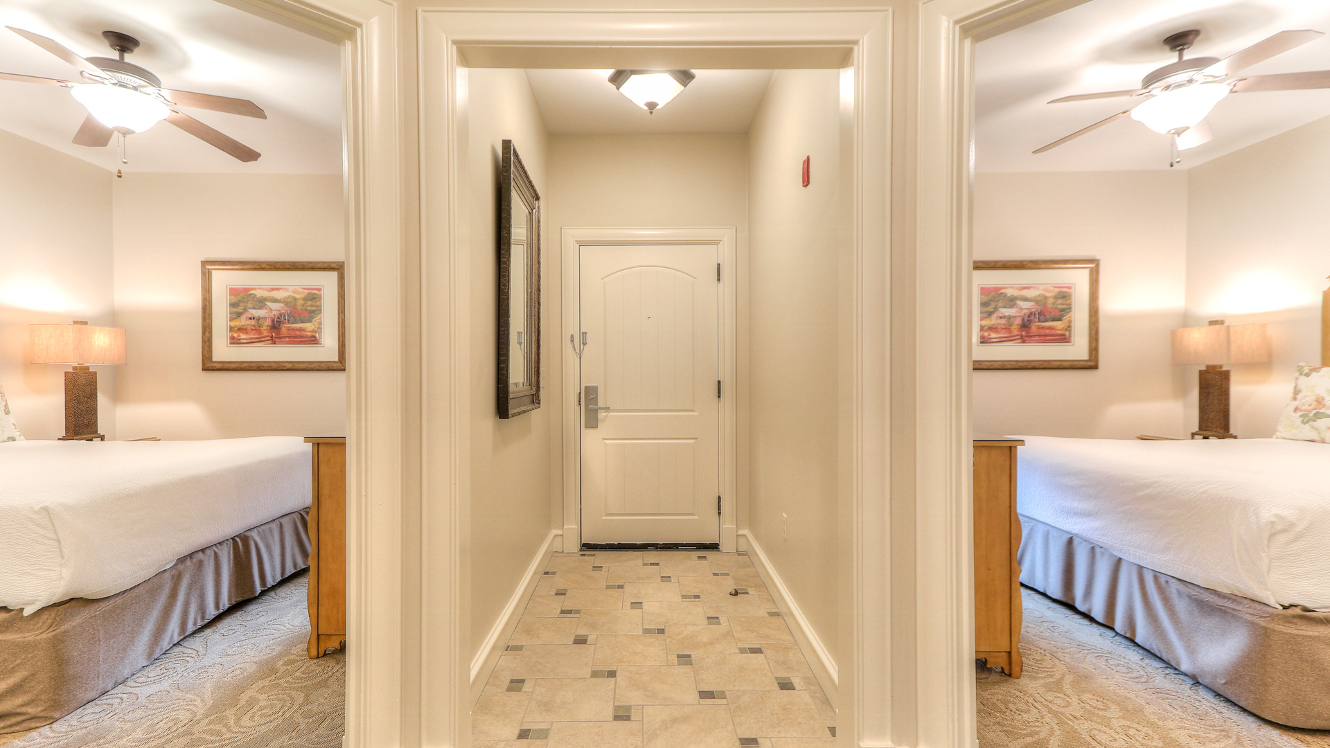 a hallway with a white door and a mirror