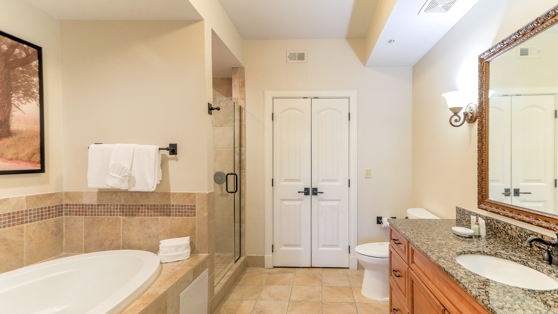 a bathroom with a bathtub and toilet