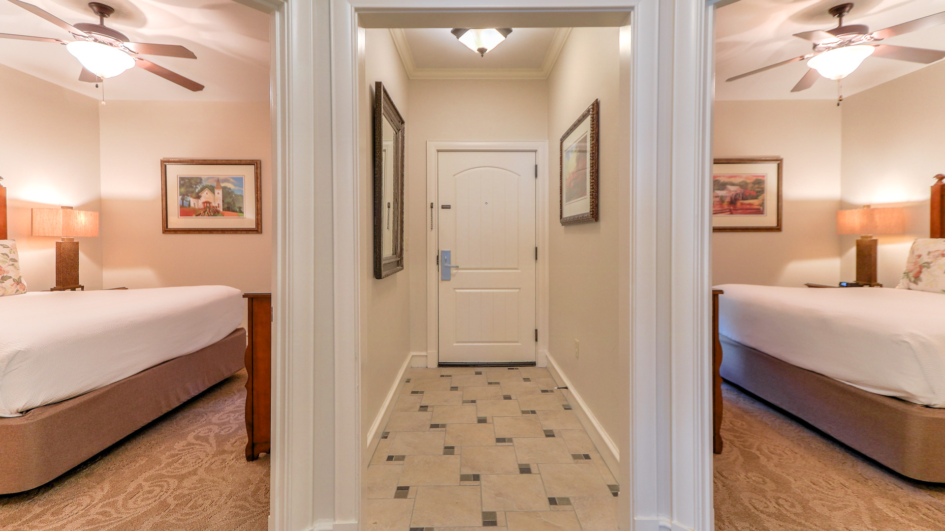 a hallway with a white door and a mirror