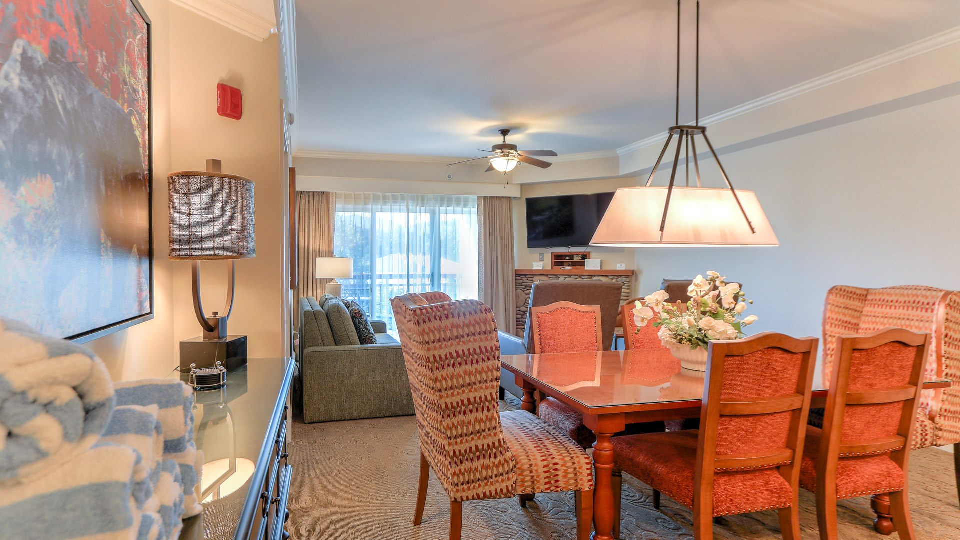 a living room with a table and chairs