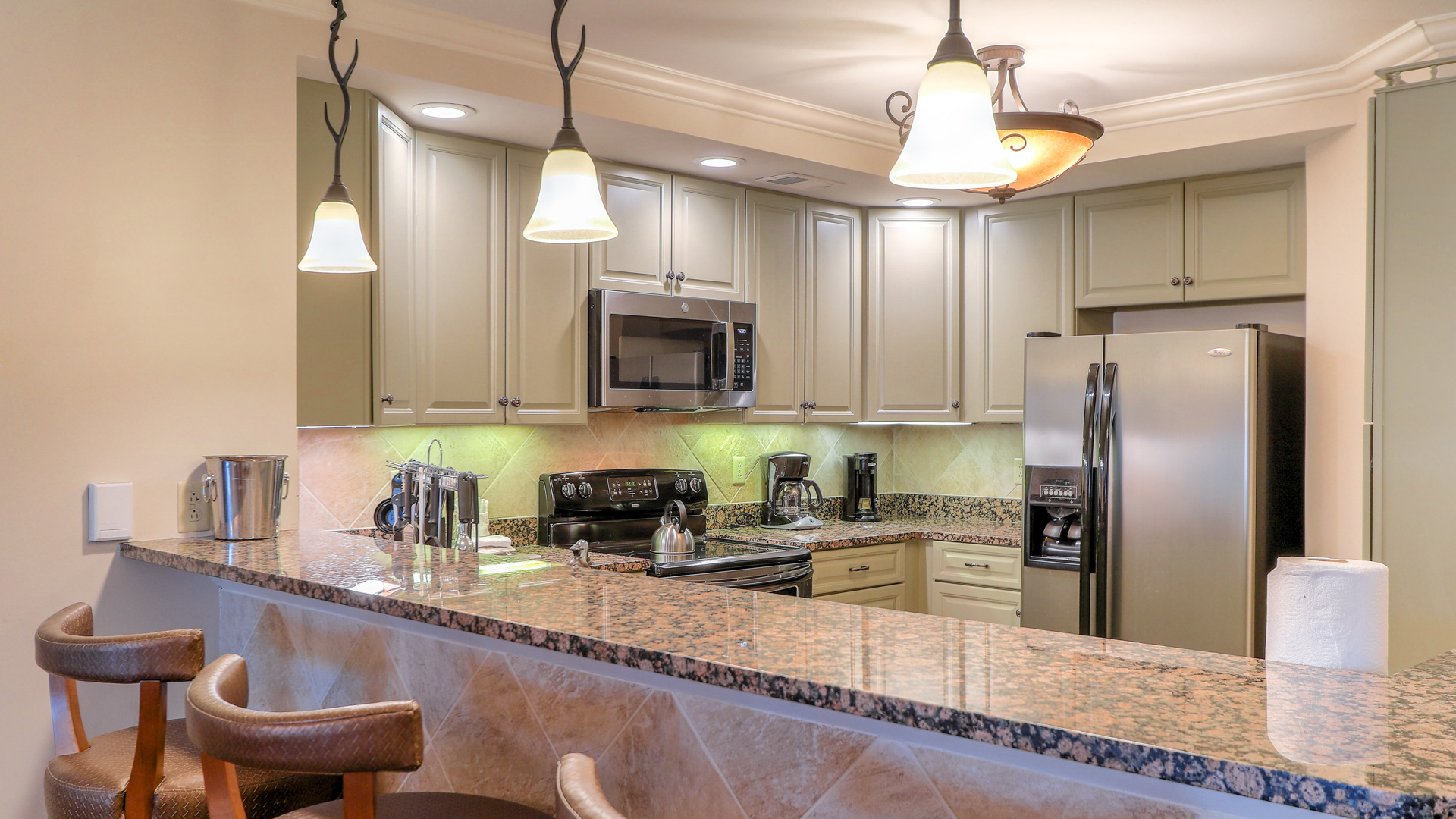 a kitchen with granite counter tops and a marble countertop
