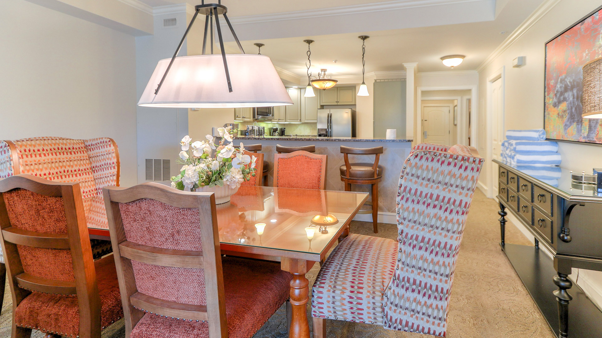 a dining table with chairs and a chandelier
