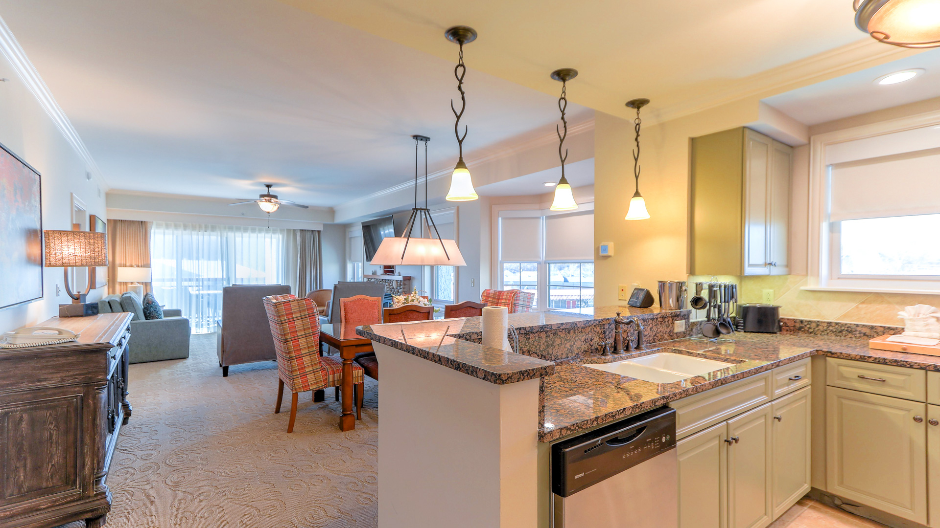 a kitchen and dining area with a dining table and chairs