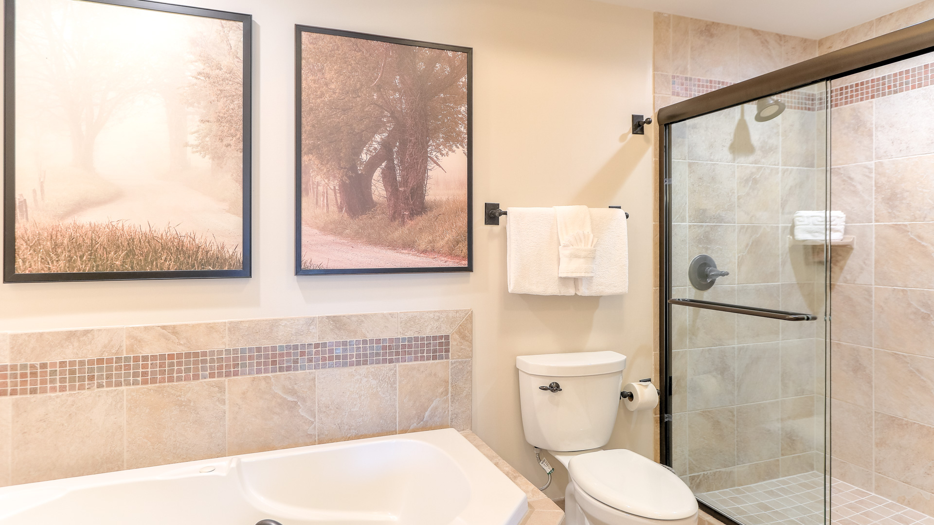 a bathroom with a tub and a toilet