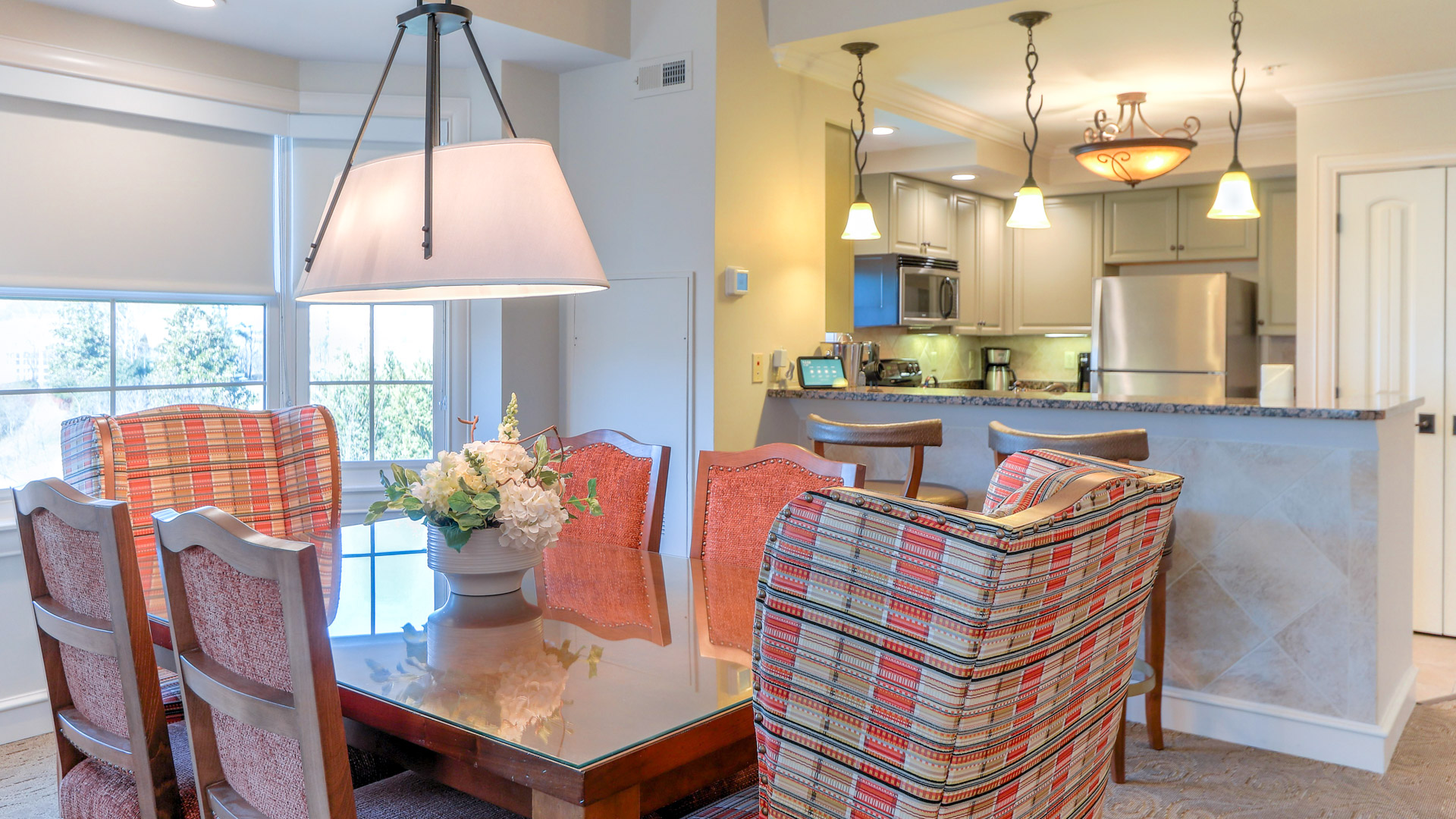 a dining room with a table and chairs