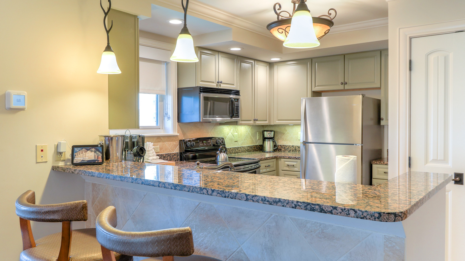 a kitchen with granite counter tops and a marble island