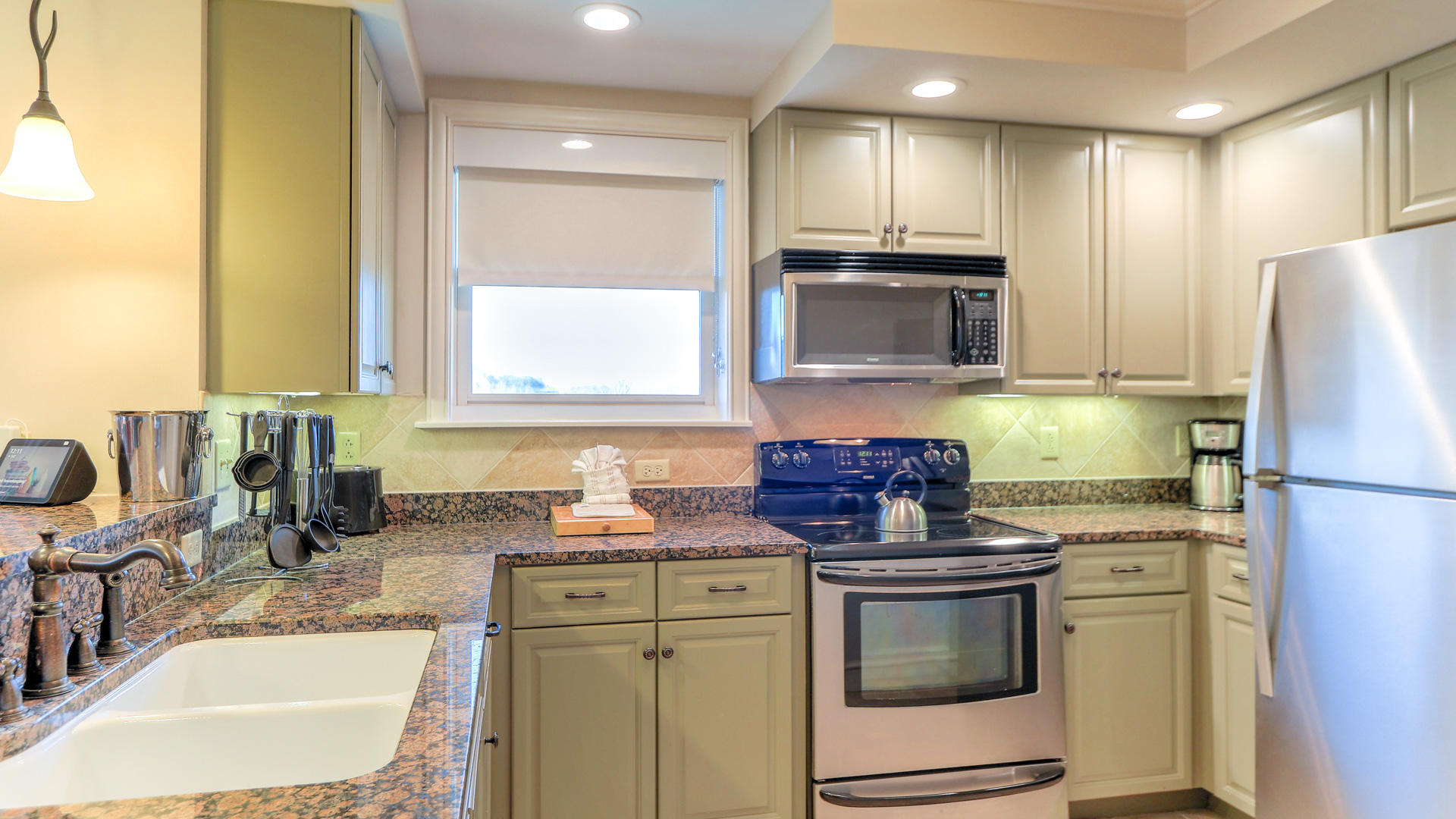 a kitchen with granite counter tops and a sink